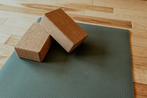 Cork yoga blocks resting on a mat