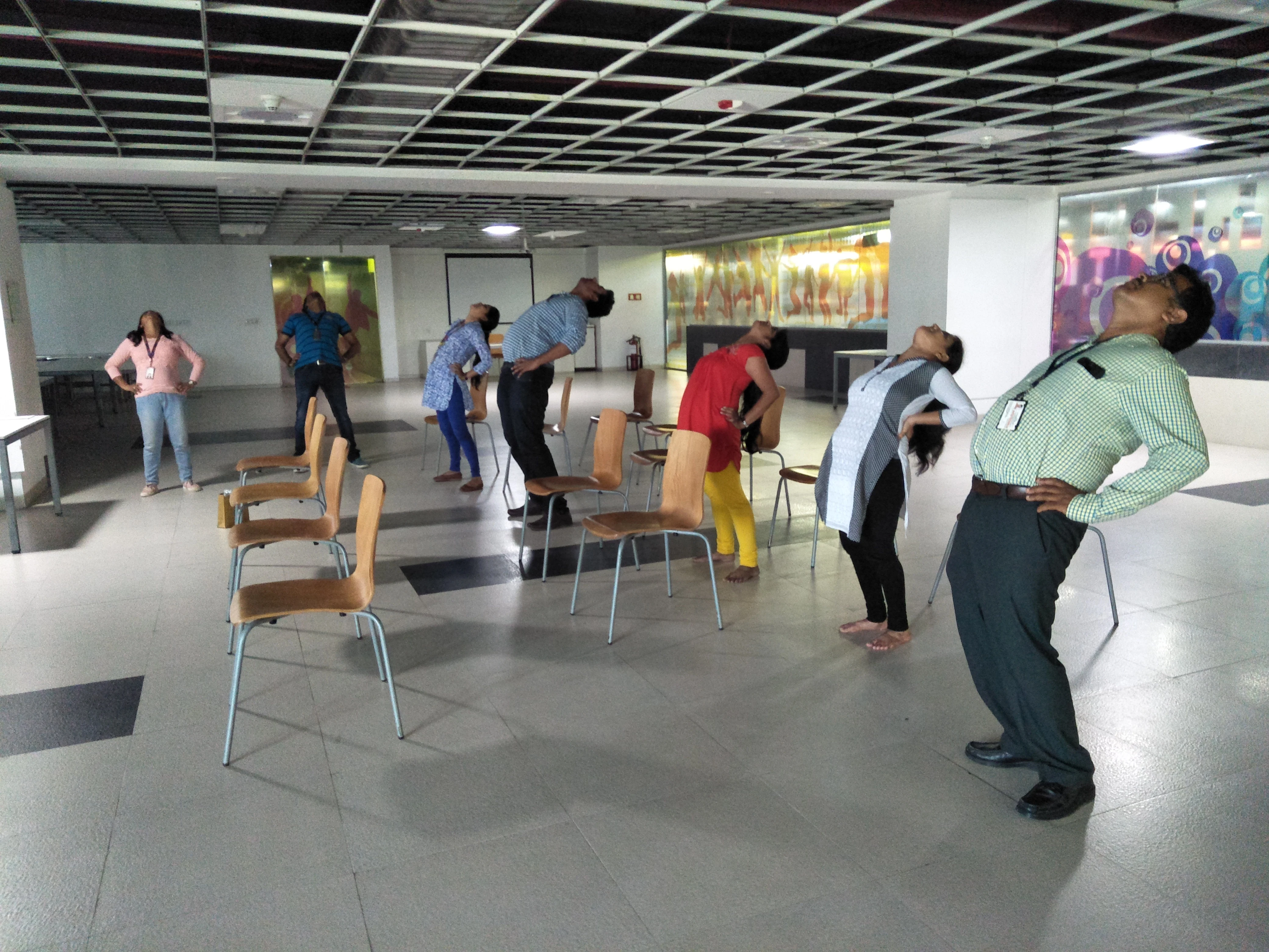 Yoga teacher training students practising together