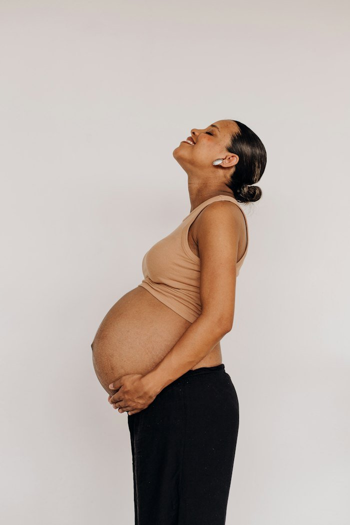 Expecting mother preparing for a gentle prenatal yoga practice