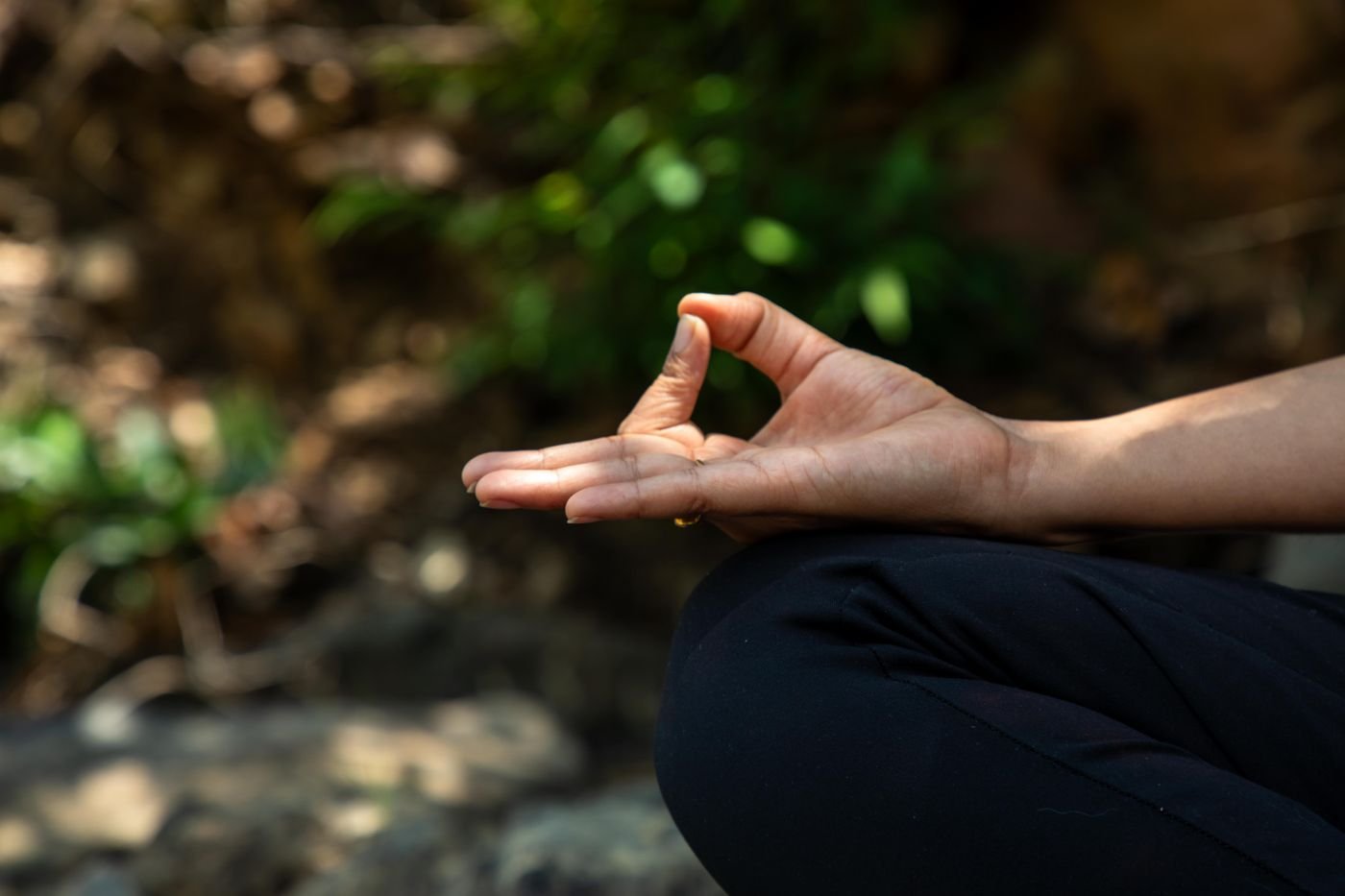 Teacher demonstrating a hand mudra
