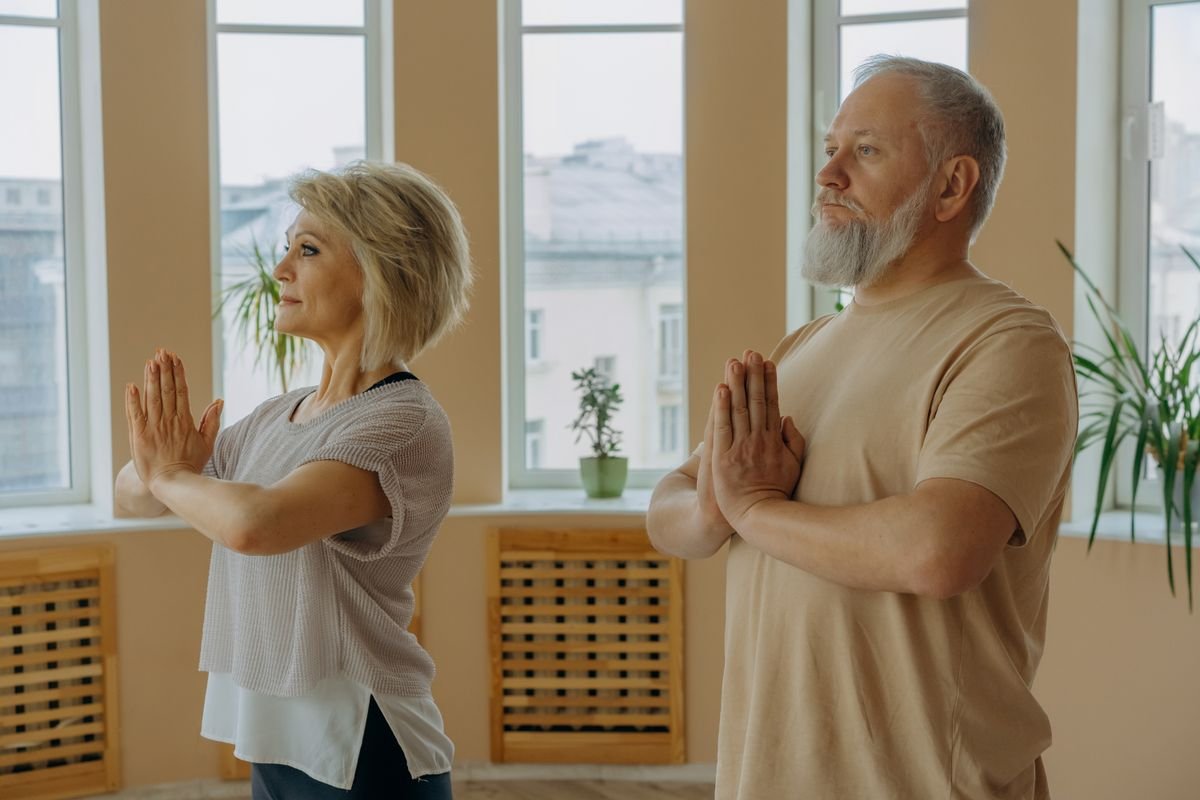 Older student practising a balance pose