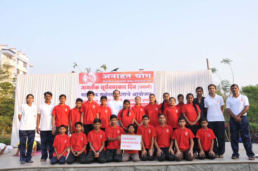Yoga instructor guiding students